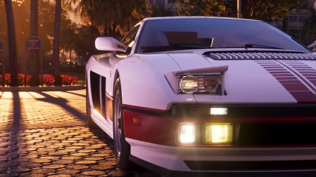A white Grotti Cheetah with a minimalist, retro-futuristic livery is parked with its headlamps up.
